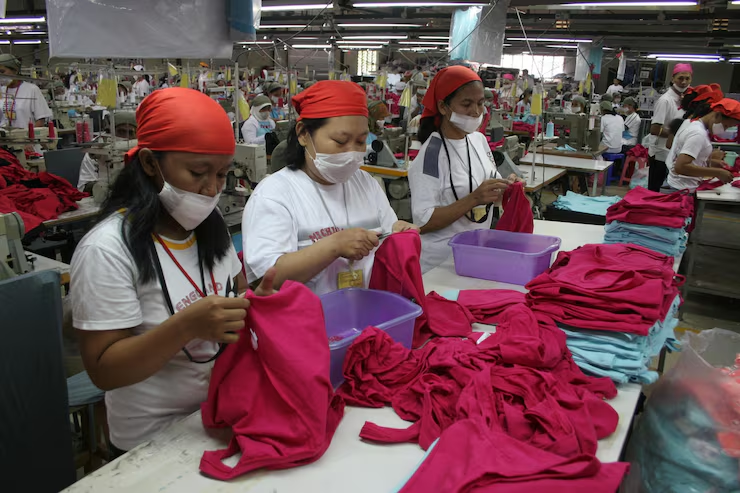 Workers in textile manufacturing facility